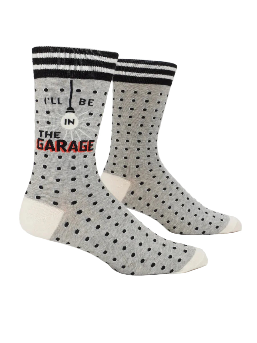 Gray polka dot socks with text on a white background