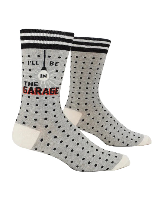 Gray polka dot socks with text on a white background