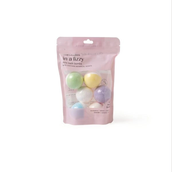 Pink packaging of mini colorful bath bombs on a white background