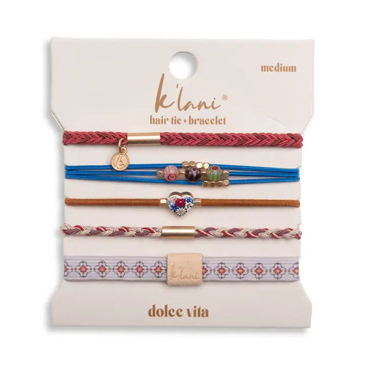 Set of hair ties and bracelets on a branded card with 'klani' and 'dolce vita' branding.