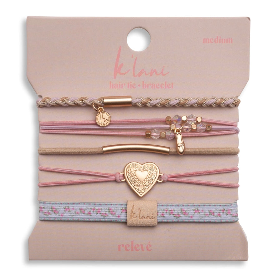 Set of hair ties with decorative elements on a branded card