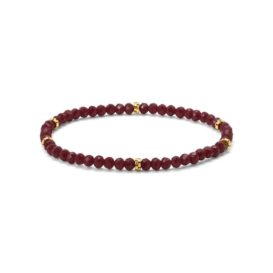 Maroon beaded bracelet with gold accents on a white background
