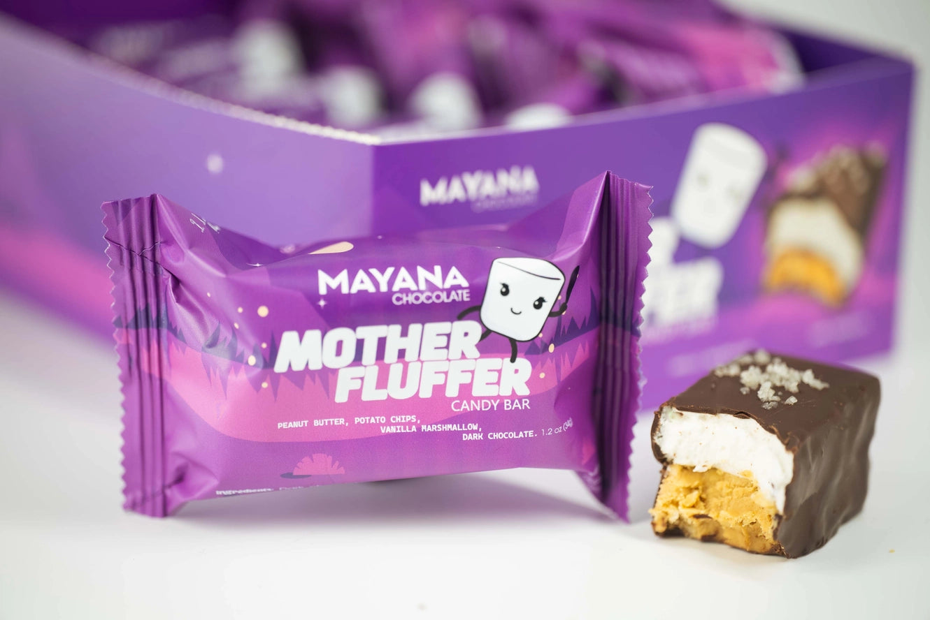 Mayana Mother Fluffer candy bar packaging with a piece of candy on a white background