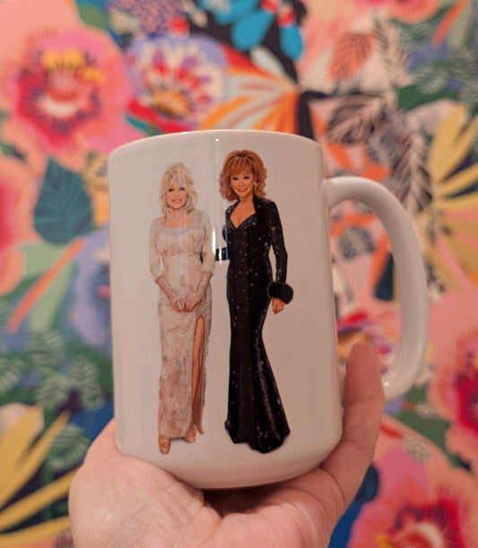 Mug with illustrations of two women in formal attire against a colorful floral background