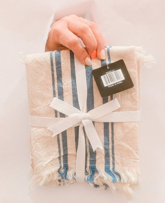 Packaged product with a ribbon and tag on a light background