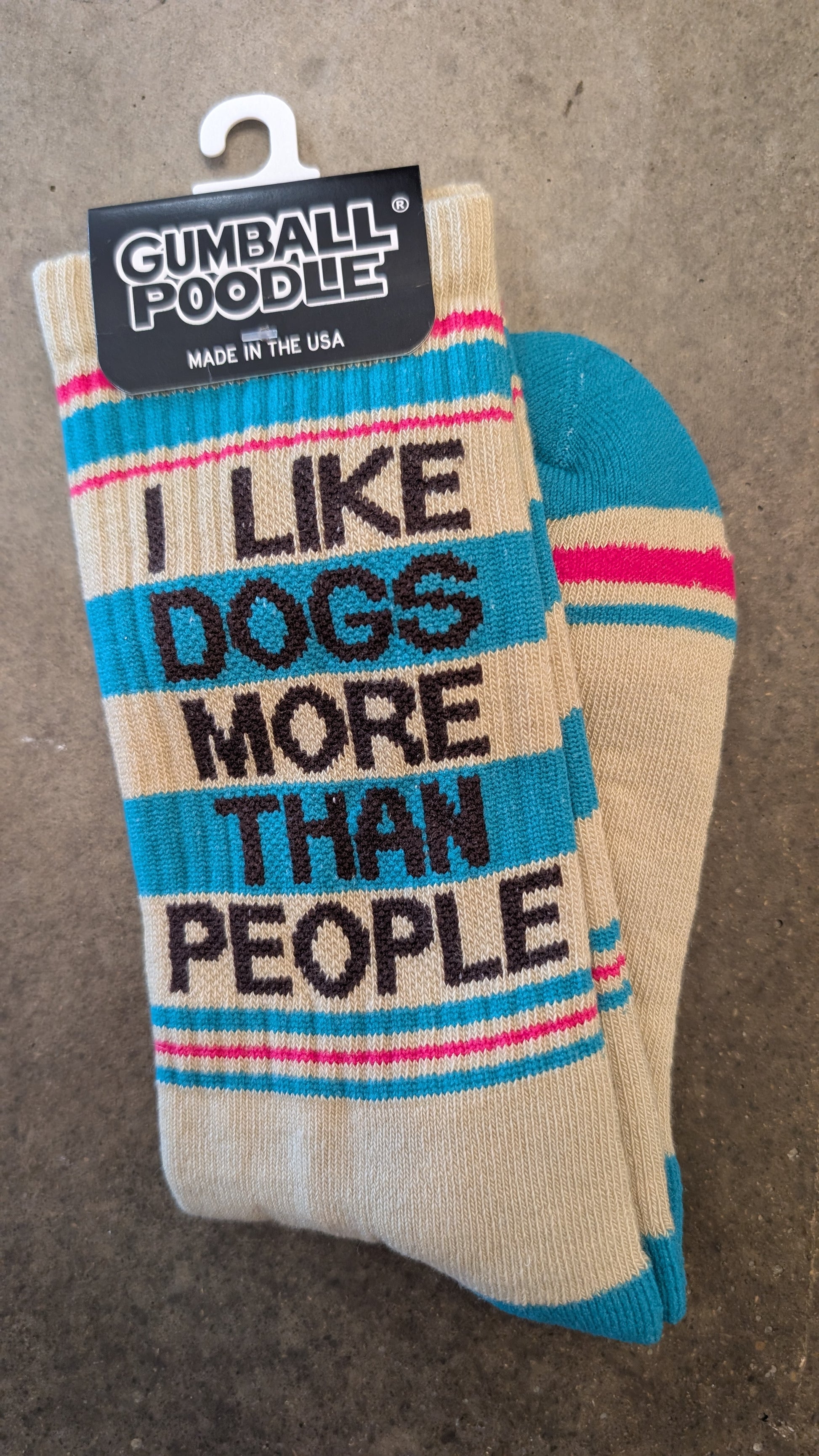 Sock with 'I Like Dogs More Than People' text on a gray background