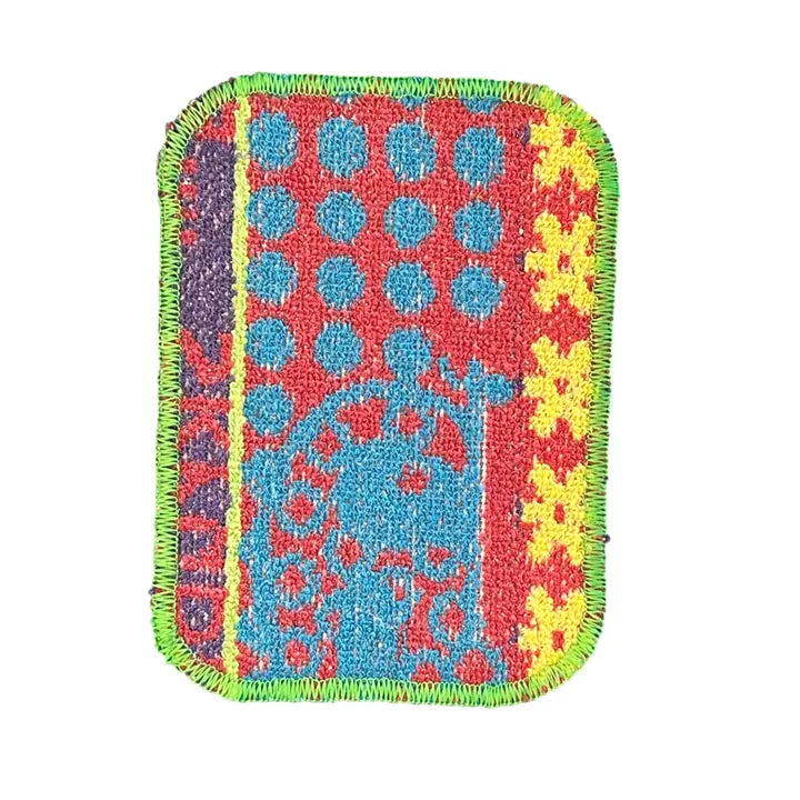 Colorful woven patch with geometric pattern on a white background