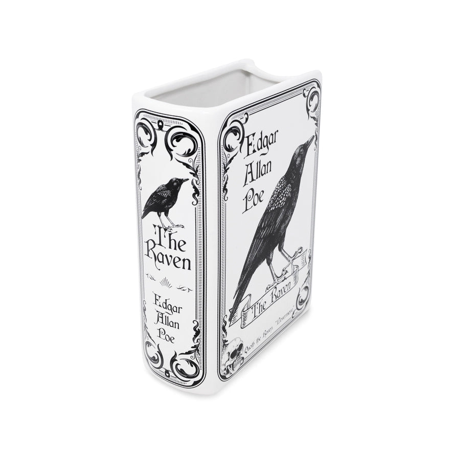 Rectangular container with black and white illustrations of a raven and text on a white background