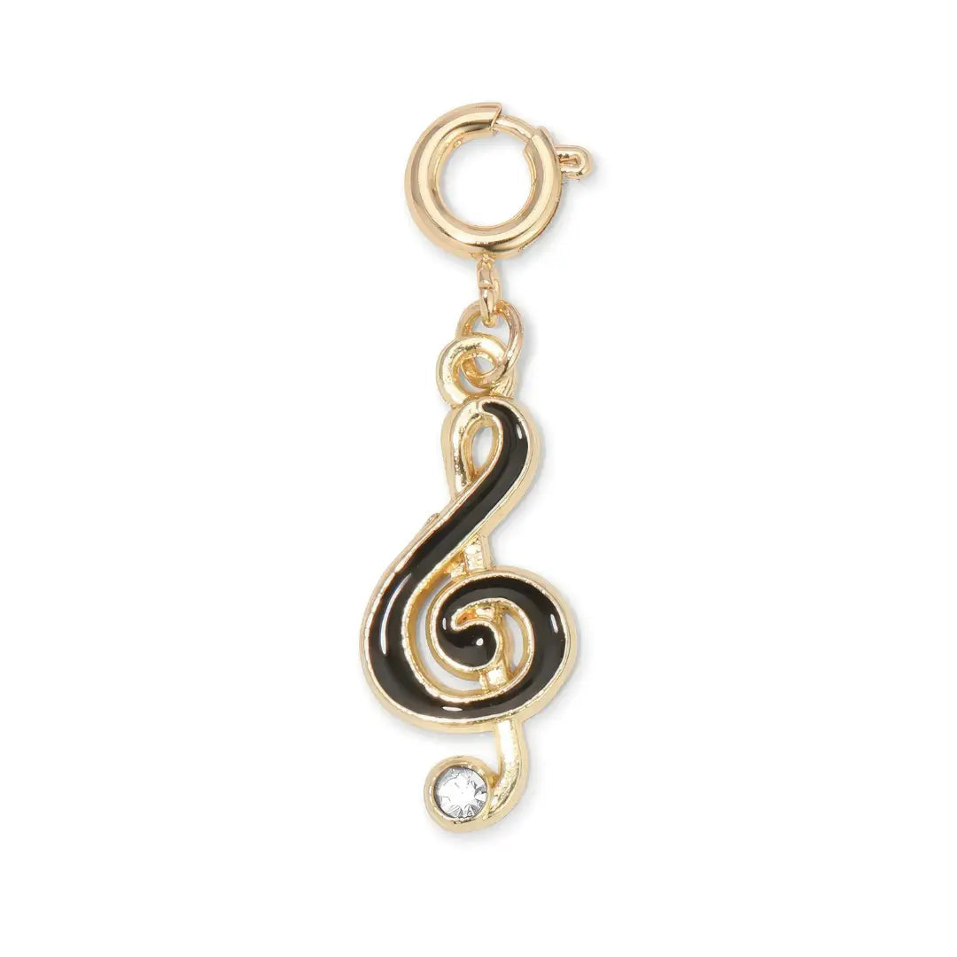 Gold and black treble clef charm with a rhinestone at the bottom on a white background