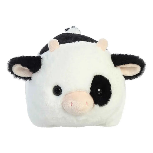 Plush toy cow with black and white pattern on a white background